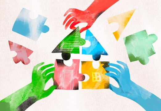 Various hands together assemble a colorful house from puzzle pieces