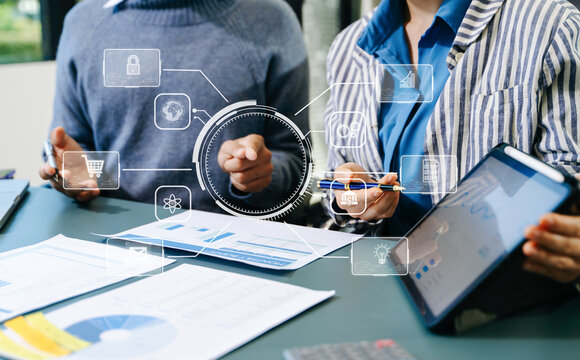 Working team meeting concept, business using laptop and smart phone and digital tablet computer with digital marketing media  in virtual icon network diagram office