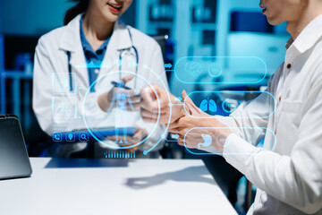 Medical technology network team meeting concept. Doctor hand working with smart phone modern digital tablet and laptop computer with graphics chart interface, with virtual icon diagram