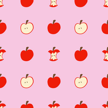 A red apple pattern on a pink wallpaper