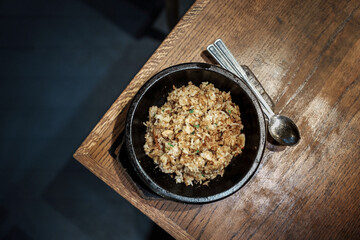 Savory Fried Rice Bowl With Peas Mushrooms And Tender Meat On Wooden Table