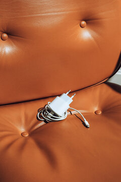 Charger on brown padded leather