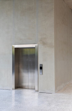 Modern elevator door in concrete wall