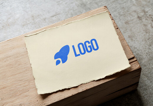 Torn Edge Paper Logo Mockup on Wooden Surface