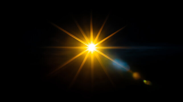 Bright golden starburst light effect with radiant beams and lens flare on a black background, creating a glowing and luminous focal point