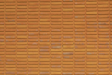 This close-up captures the subtle imperfections of a painted stucco wall. The aged, uneven surface provides a versatile abstract backdrop for interior design or product display.