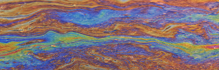 spilled gasoline rainbow background, industrial hazard spill pollution, abstract texture multicolored