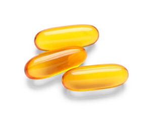 Vitamin E capsules on white background