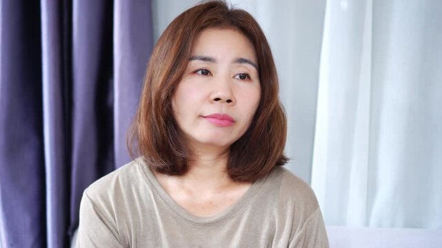 Burnout Asian woman feeling emotionally drained, bored, and dead inside,  mental health struggles and stress concept ,emotional exhaustion, depression, anxiety, work-life imbalance, psychological 