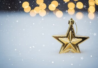 Golden Christmas star ornament in snow with warm glowing festive lights