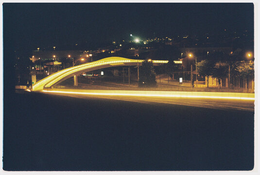 Brightly Lit Pedestrian Bridge at Night in Belem