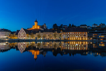 Fototapeta premium The old Swiss city Schaffhausen with its landmark Munot at the blue hours 
