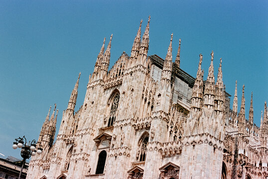the ornate gothic facade of the Milan Cathedral, 35mm film