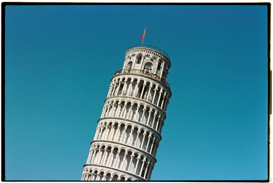 the leaning tower of Pisa against a clear blue sky, 35mm film
