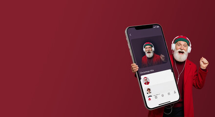 Santa claus holding large smartphone with social media profile. Elderly bearded man in red suit using tech for holiday delivery. Modern christmas new year celebration concept with digital