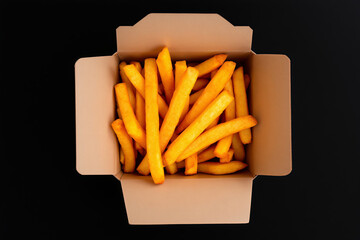 French Fries in Takeout Box: Golden Crispy Potato Fries, Fast Food, Delicious Snack, Top View, Black Background, Food Photography