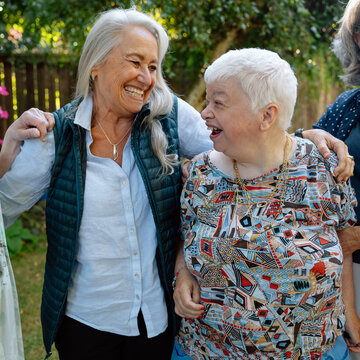 Smiling seniors share a joyful moment at a family gathering