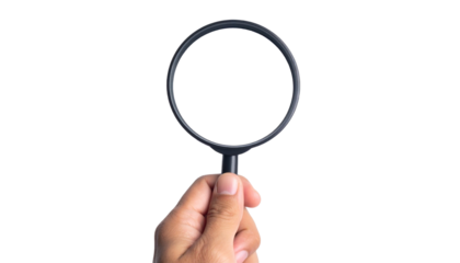 Close up of Holding a Magnifying Glass Isolated on Transparent Background