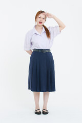 Fototapeta premium tudio portrait of asian cheerful happy young teenage girl woman wearing eyeglasses white blouse navy pleated skirt posing on white background, student high school uniform, education lifestyle concept