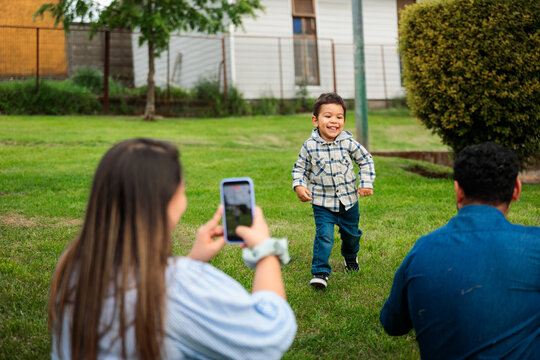 Hispanic Family Having Fun Time Together with Son
