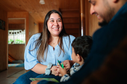 Mother Smiling Warmly at Family Moment