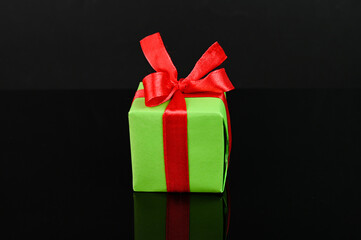 Holiday shopping. Isolated gift on a black background.