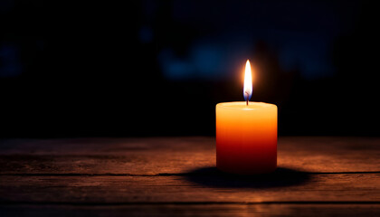 burning candle on a dark background