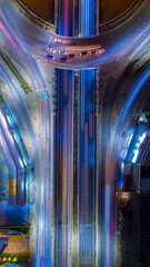 Expressway top view, Road traffic an important infrastructure, car traffic transportation above intersection road in city night, aerial view cityscape of advanced innovation, financial technology	