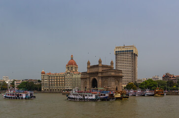 The iconic Gateway of India monument flanked by the historic Taj Mahal Palace Hotel