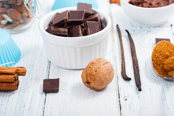 muffin baking ingredients on white wooden table