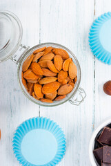 muffin baking ingredients on white wooden table