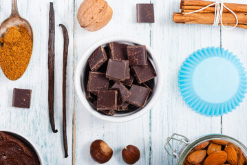 muffin baking ingredients on white wooden table