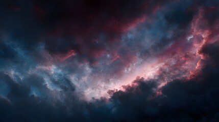 Fototapeta premium Dramatic twilight sky with vibrant pink blue and red clouds against dark textured formations