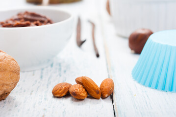 muffin baking ingredients on white wooden table