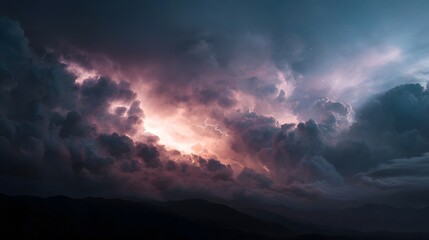 Fototapeta premium A powerful lightning bolt illuminates dark dramatic storm clouds above a silhouetted mountain range at dusk