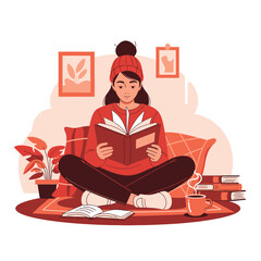 Young woman engrossed in reading a book while sitting cross-legged.