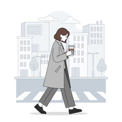 Woman in a stylish coat walking with a coffee cup.