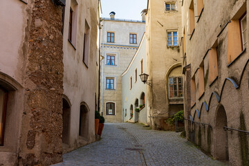 Fototapeta premium Historic European Cobblestone Alley, Old Town Architecture, Narrow Street with Stone Buildings, Vintage Travel Destination, Medieval Cityscape