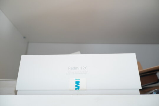 Retail packaging box for the Xiaomi Redmi 12C smartphone sitting on a white shelf