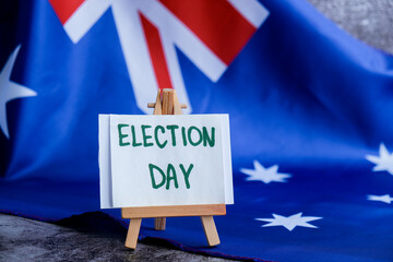 Australian flag with message text ELECTION DAY for political coverage. Patriotic signage and flag...