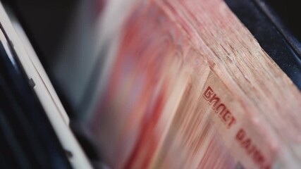 5000 Russian rubles in electronic money counting machine, accounting. Financial transaction in the bank. RUB Mortgage, Seller or broker considers finances. Economic crisis in Russia. Slow motion - Powered by Adobe