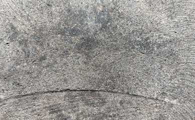 Close-up of natural andesite stone texture with organic rough surface and grey tones, showing authentic detail suitable as rustic background for design or craft visuals.