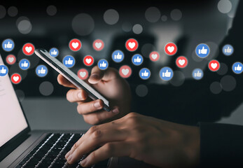 Multitasking in the Age of Social Media Engagement, Hands on phone and laptop surrounded by likes and hearts