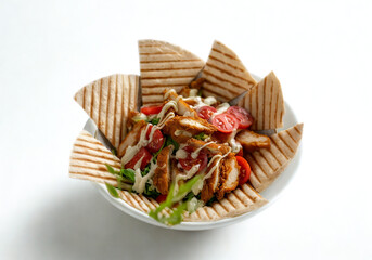 Hearty grilled chicken salad with toasted pita bread