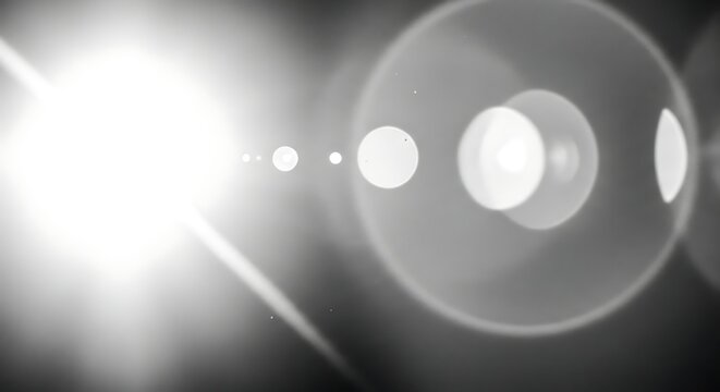 Bright white lens flare effect overlay on black background creating a dramatic and eyecatching composition