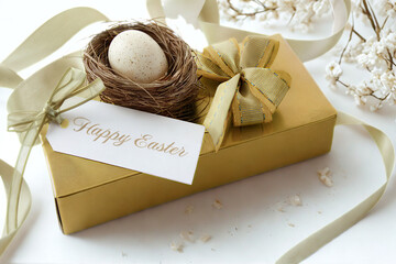 Elegant easter gift box with nest and egg