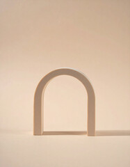 Minimalist arch sculpture on a neutral background