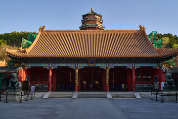 Red pavilion with golden roof on waterfront, Summer Palace Beijing, traditional Chinese temple architecture, horizontal composition