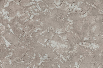 Wall with a textured surface that appears to be made of concrete