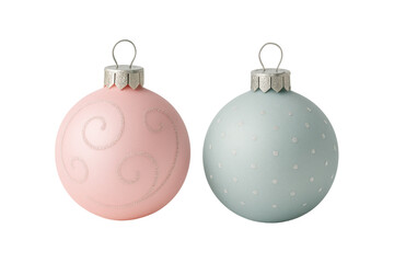 Two matte pastel Christmas baubles with subtle glitter patterns and silver hooks, isolated on clean white background